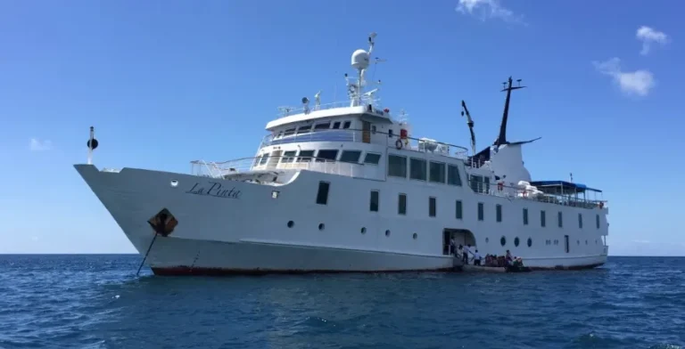 La Pinta expedition ship anchored on calm blue sea